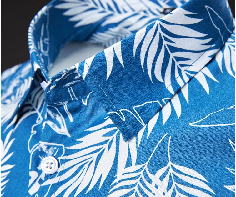Blue shirt with white leaf pattern on a dark background