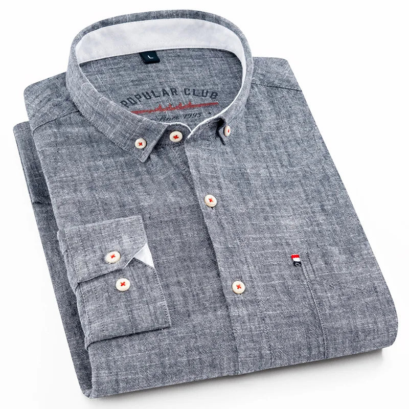 Folded gray shirt with brand label on a white background