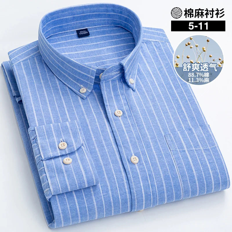 Folded blue striped shirt with brand label on a white background