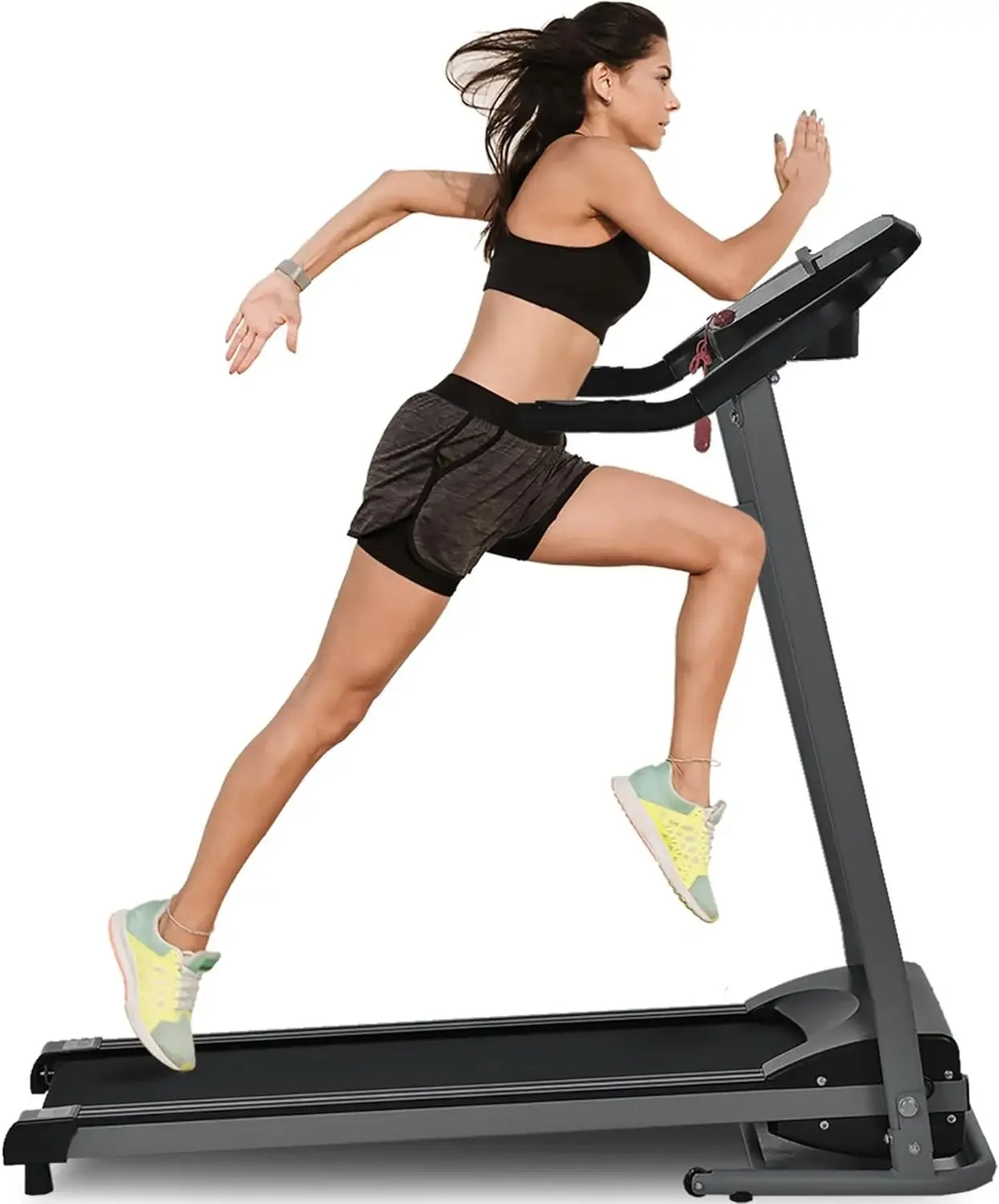 Side view of a woman running on a black treadmill with an upright console and handrails.