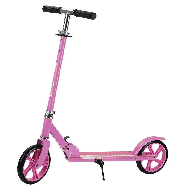 Pink kick scooter shown from the side with its kickstand extended