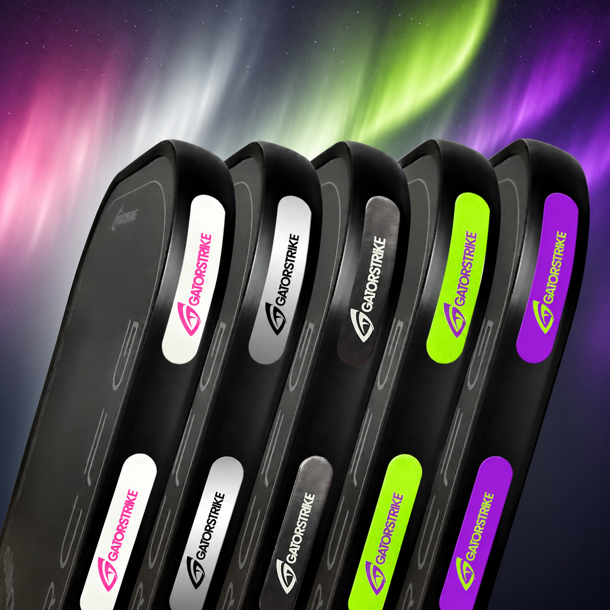 Set of black golf club heads with colorful brand logos against a vibrant Northern Lights background