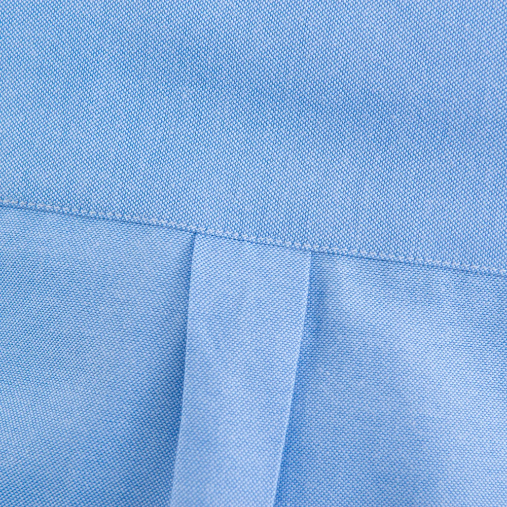Close-up of blue fabric with a subtle pattern