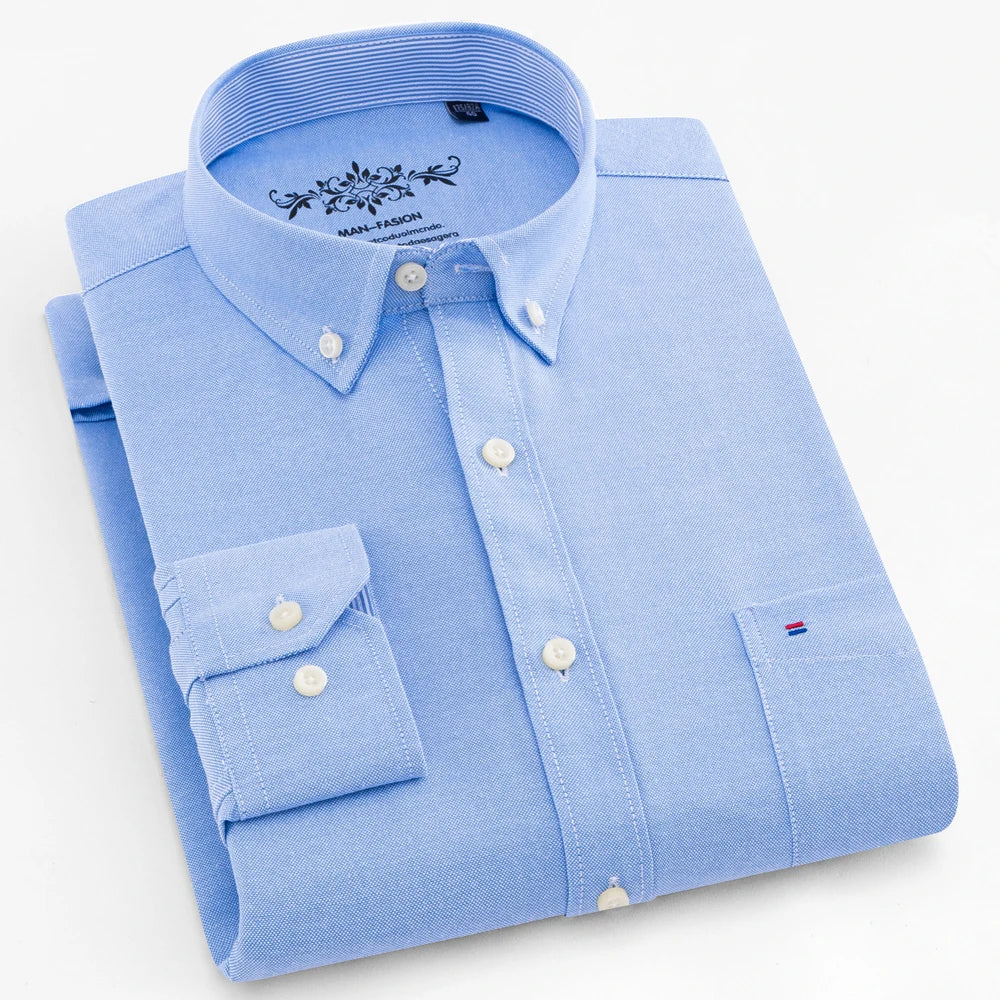 Folded light blue shirt with brand logo on a white background