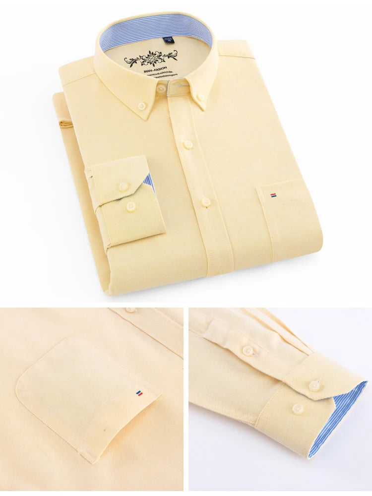 Folded yellow dress shirt with blue collar and cuffs on a white background