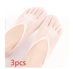 Three pairs of beige socks on a white background
