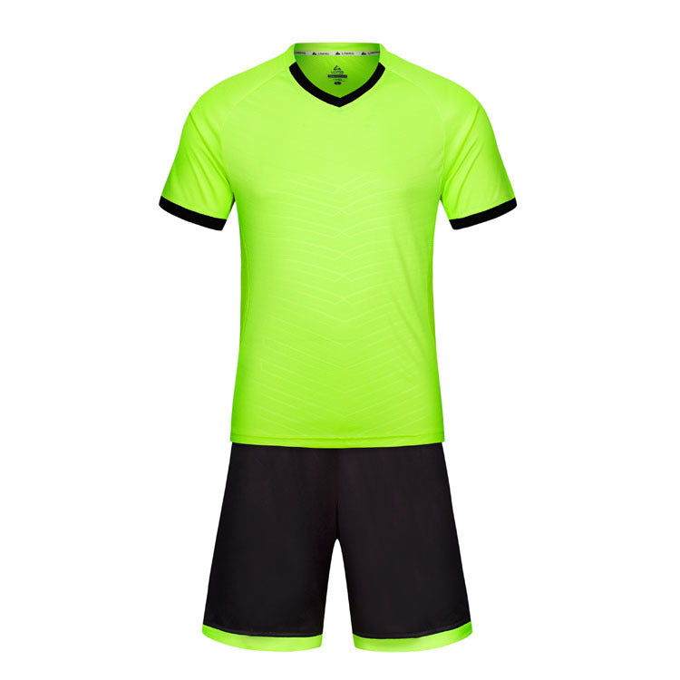 Neon green sports jersey and black shorts set on a white background