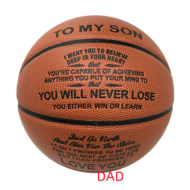 A brown basketball with black printed motivational text for a dad, including 'TO MY SON' and 'LOVE YOU', with 'DAD' written in red below the ball on a white background.