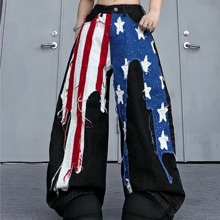 Pants with American flag design and star patterns against a gray door background
