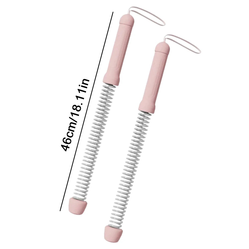 Two pink spring-loaded tools with measurement text on a white background