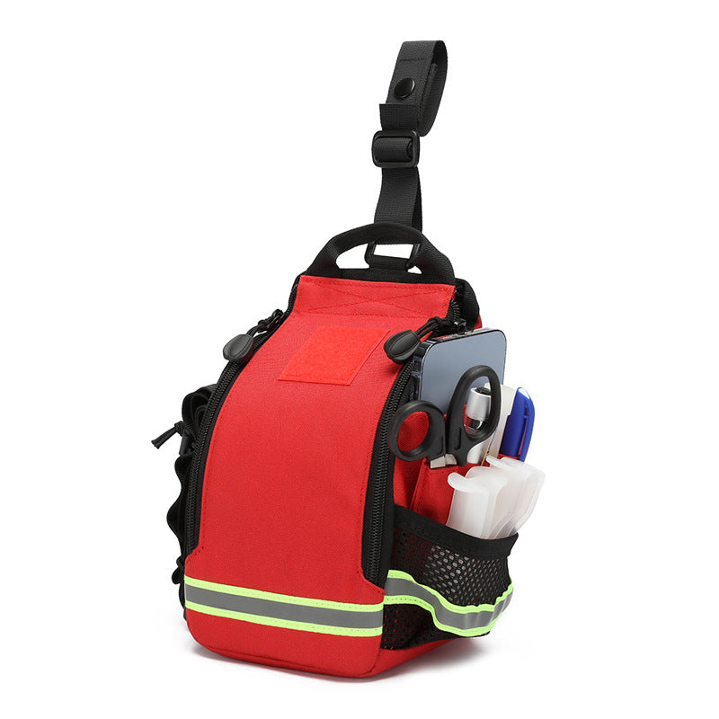 A red and black emergency first aid kit pouch with reflective yellow-green stripes, shown on a white background with various medical supplies tucked into its side pockets.