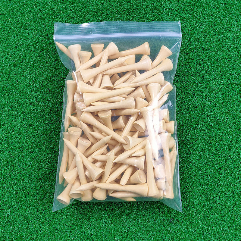 Bag of wooden golf tees on a green grass background