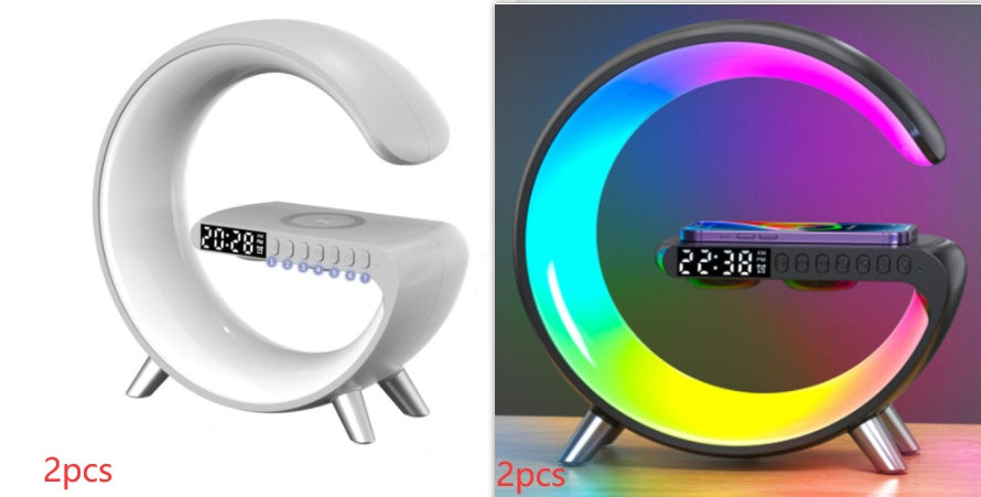 White and black crescent moon-shaped digital clock with RGB lighting on a white background.