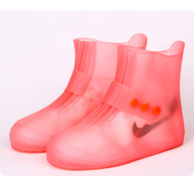 Pink rain boots with a visible brand logo on a white background