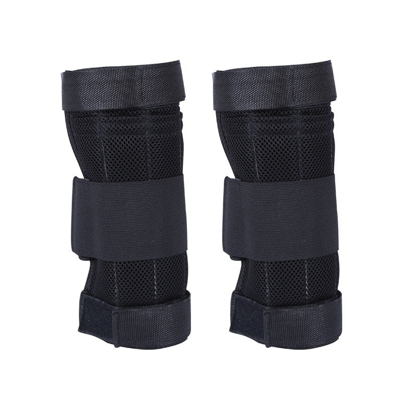 Pair of black protective knee pads on a white background