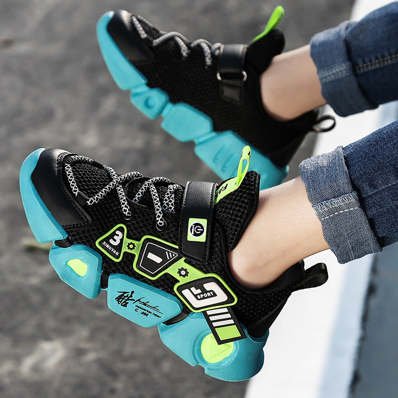 Black and teal sneakers with green accents worn by a person on a blurred background