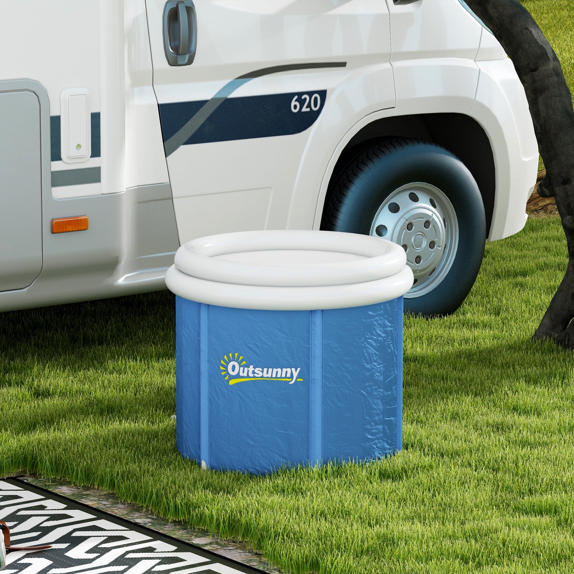 Blue inflatable cooler with white lid next to a white RV on grass