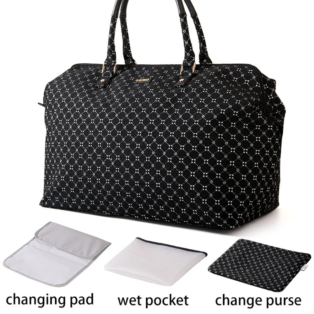 Black patterned diaper bag with changing pad, wet pocket, and change purse on a white background