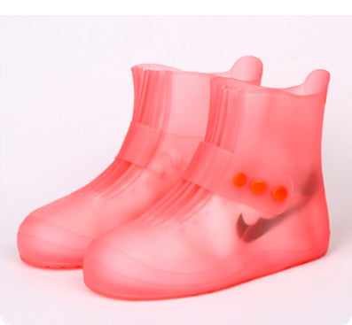 Pair of pink rain boots on a white background