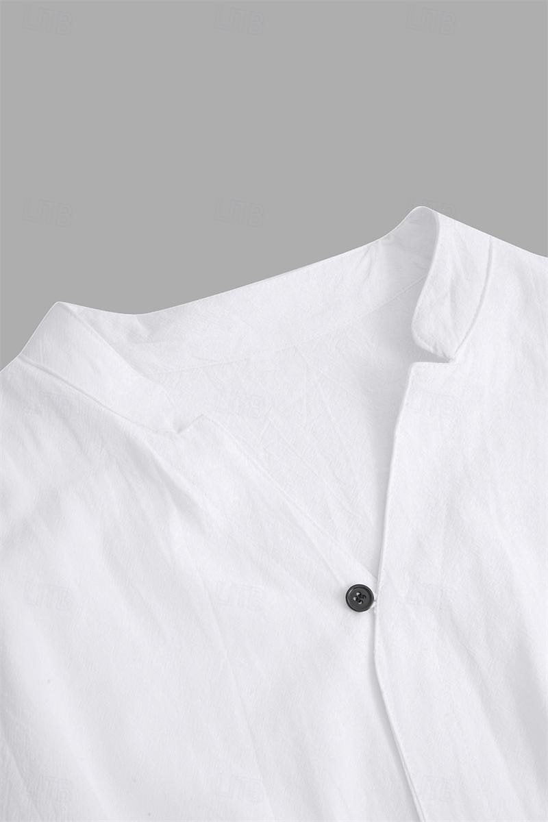 Close-up of a white shirt with a black button on a gray background
