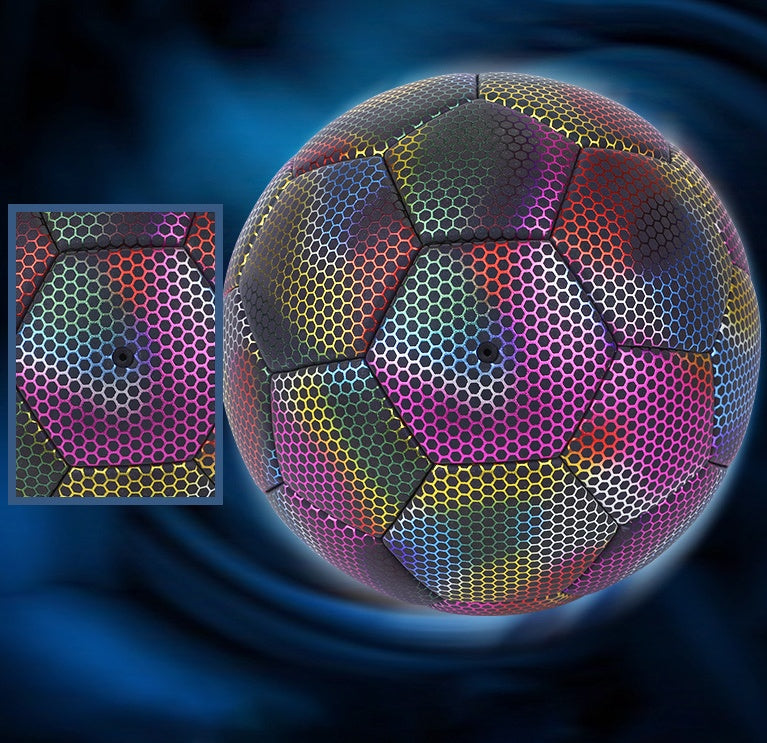 Colorful soccer ball with a close-up inset showing hexagonal pattern on a dark blue background