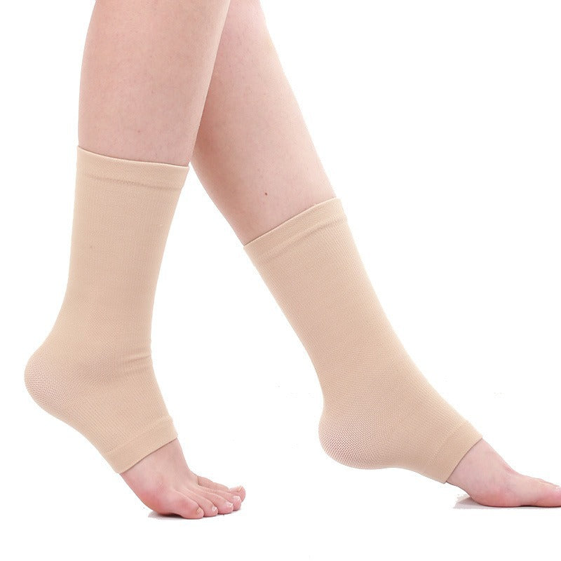 Beige ankle compression socks worn on a person's legs, shown against a plain white background.