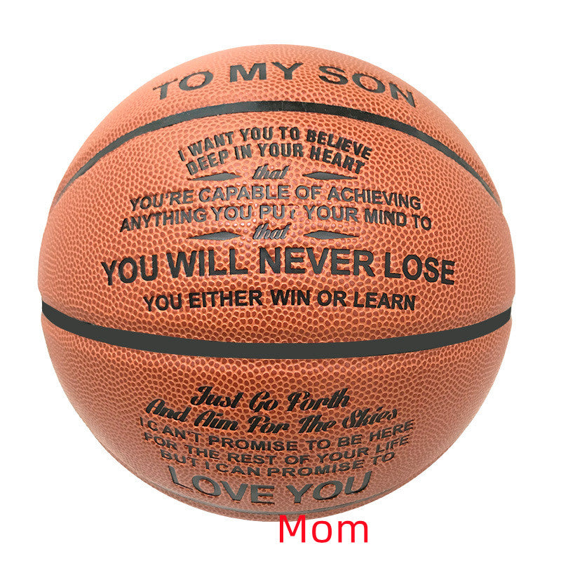 An orange basketball with black printed inspirational text, including 'TO MY SON' and motivational quotes, shown on a plain white background with a red 'Mom' text overlay at the bottom.