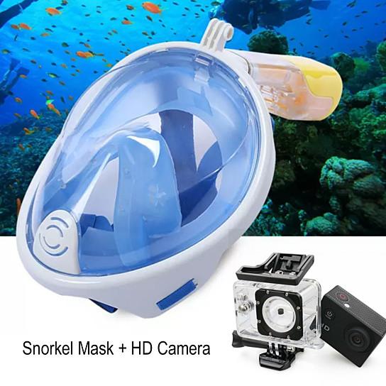 Snorkel mask with HD camera attachment in front of an underwater scene with fish and coral.