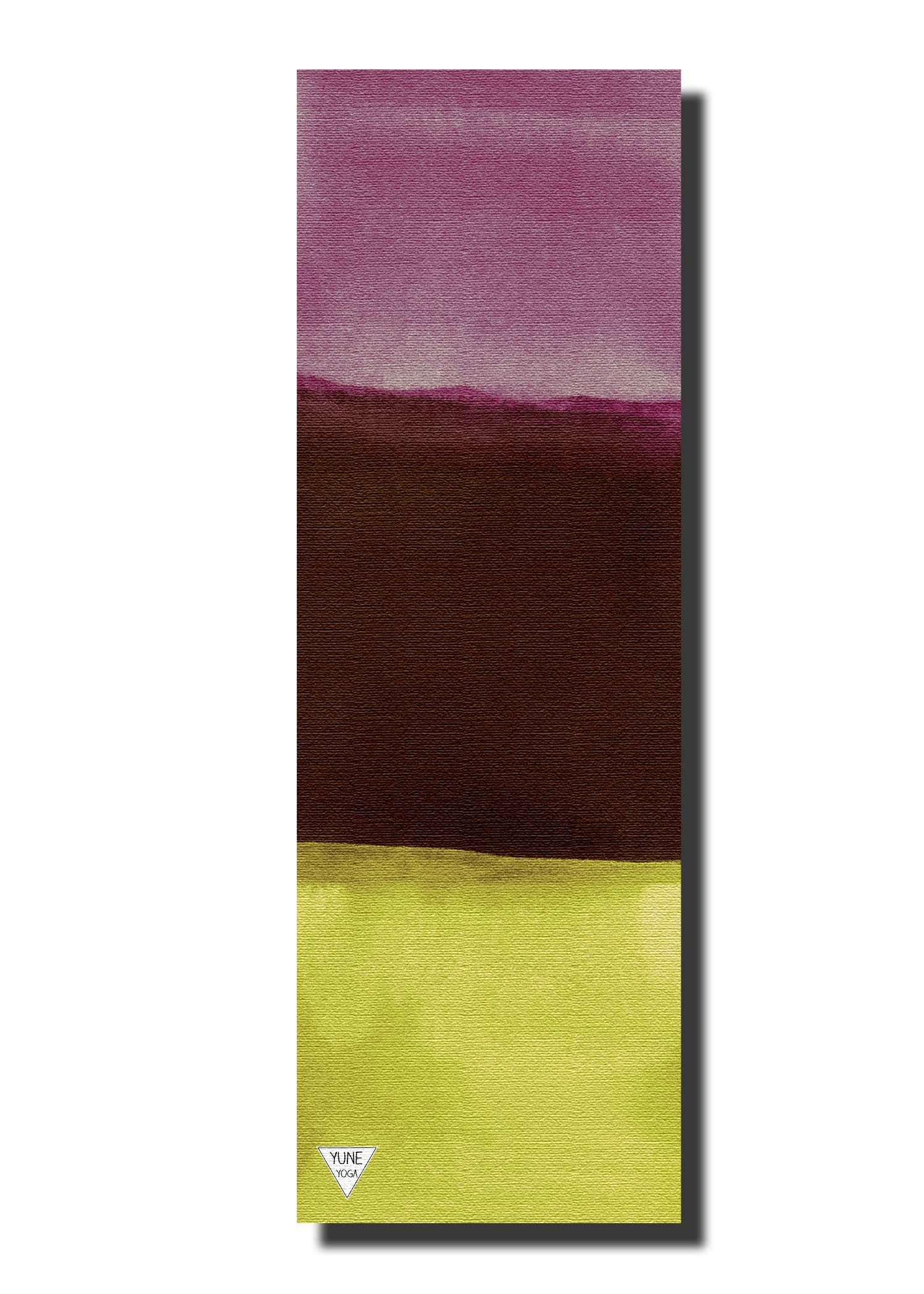 Yoga mat with gradient design from purple to brown to green on a white background