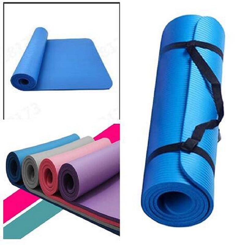 Blue yoga mat with black strap on a white background